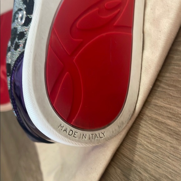 Black & Purple Women's Sneakers
made in Paris by Christian LOUBOUTIN
Red bottom - Picture 3 of 16